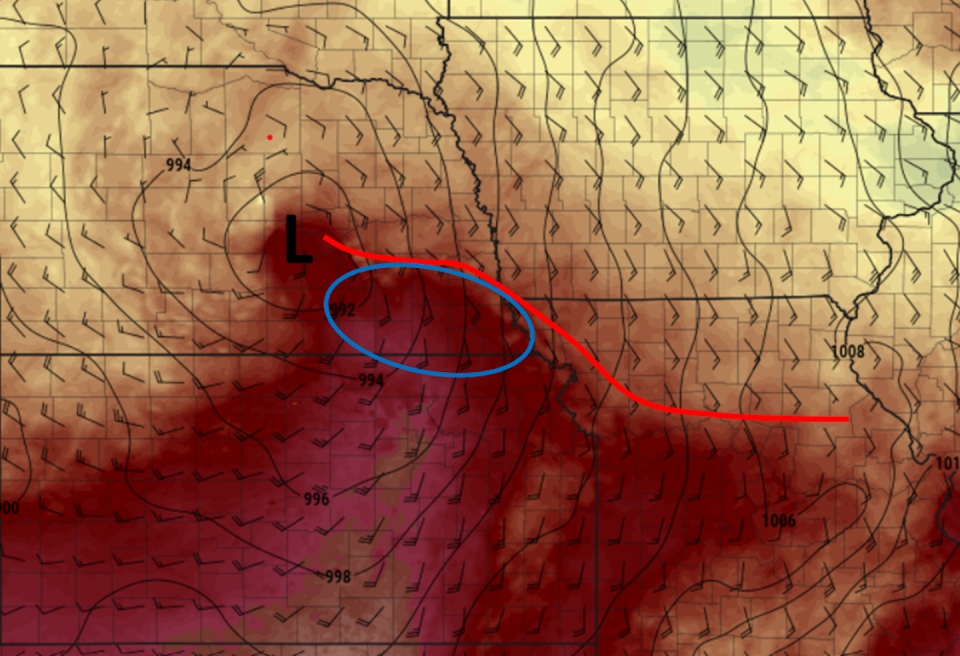 Surface temperatures (colors), winds (barbs indicating direction the wind was blowing from), surface pressure (solid black contours) indicating the location of the low pressure system (L), the warm front (red line) and the region of favorable conditions (blue circle) on the evening of April, 26, 2024. <a href="http://www.pivotalweather.com/" rel="nofollow noopener" target="_blank" data-ylk="slk:Pivotal Weather;elm:context_link;itc:0;sec:content-canvas" class="link ">Pivotal Weather</a>