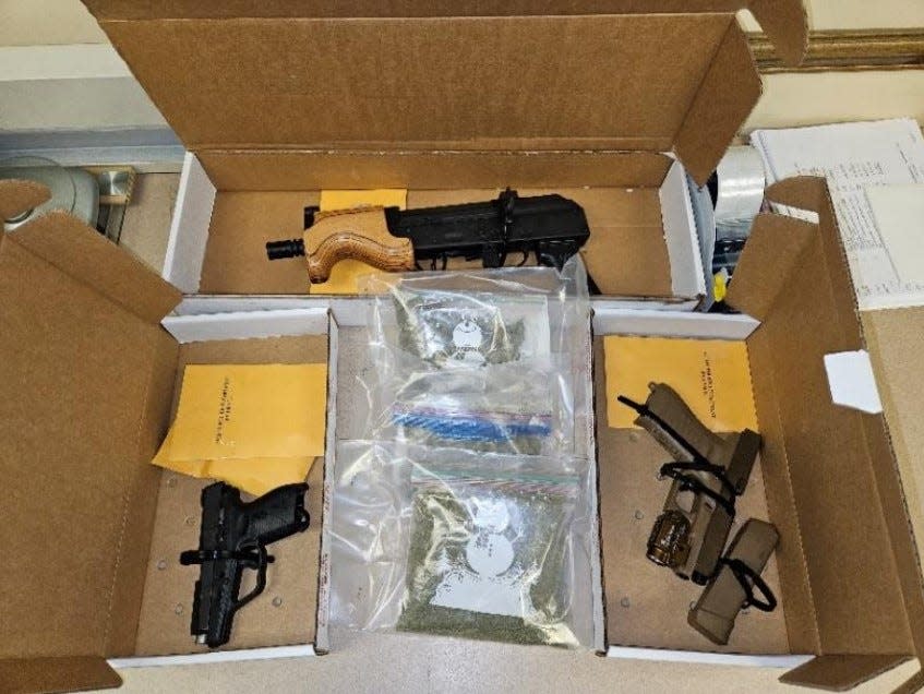 A 36-year-old man was charged with aggravated robbery, aggravated menacing, possession of drugs, and weapons under disability. During a residence search, at least two guns, a rifle, and around 8 pounds of suspected methamphetamines, marijuana, and drug instruments were found.