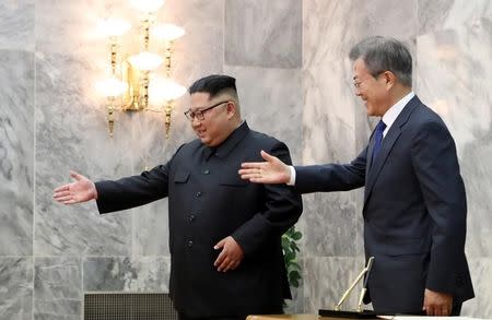 FILE PHOTO: South Korean President Moon Jae-in and North Korean leader Kim Jong Un attend their summit at the truce village of Panmunjom, North Korea, in this handout picture provided by the Presidential Blue House on May 26, 2018. The Presidential Blue House /Handout via REUTERS