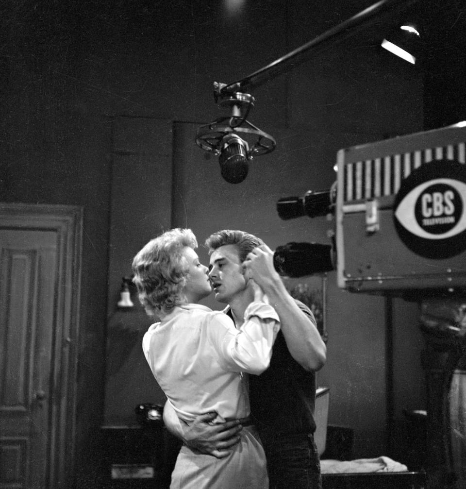 <p>Throughout the '50s, Dean scored minor roles in big pictures like <em>Fixed Bayonets!, Sailor Beware, </em>and shows like <em>Kraft Television Theater</em>. Here, Dean is seen dancing in a scene with actress Betsy Palmer in the CBS show, <em>Danger</em>. </p>