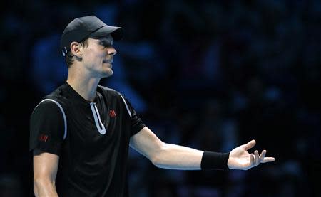 Tomas Berdych of the Czech Republic disputes a line judge's call during his men's singles tennis match against Stanislas Wawrinka of Switzerland at the ATP World Tour Finals at the O2 Arena in London November 4, 2013. REUTERS/Suzanne Plunkett