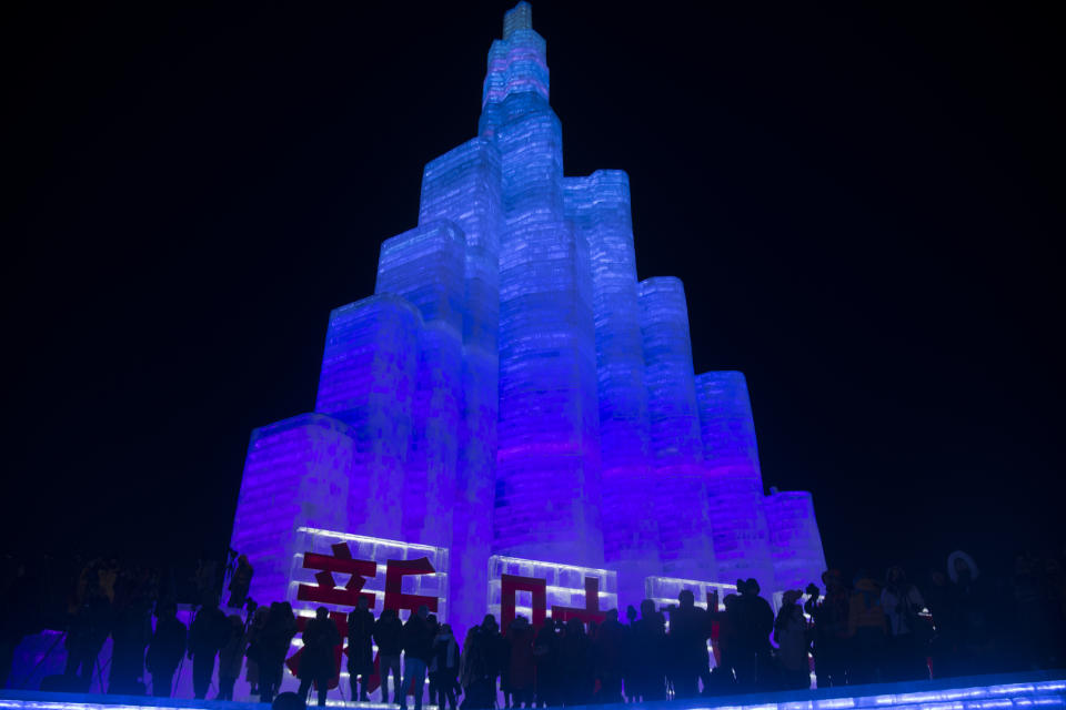 Tourists visit illuminated ice sculptures at Ice and Snow World park on Jan. 5, 2019, in Harbin, China. (Photo: Tao Zhang/Getty Images)