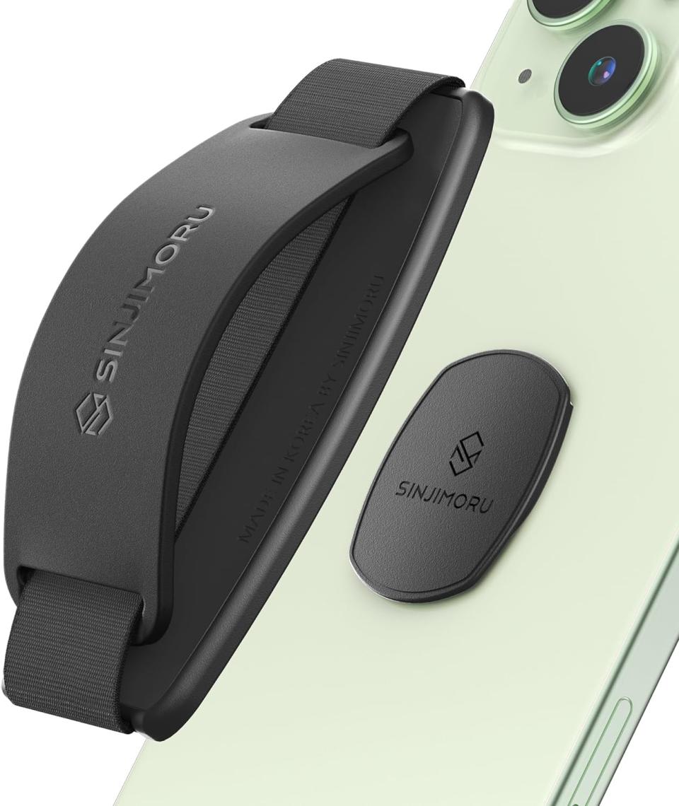 black detachable phone grip on green phone