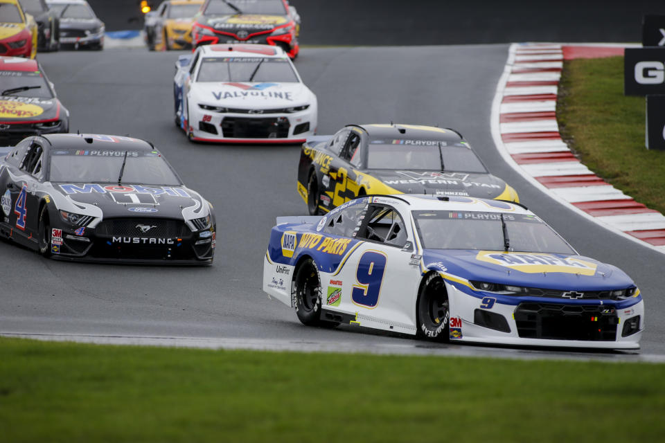 Chase Elliott (9) leads the way out of Turn 7 in a NASCAR Cup Series auto race at Charlotte Motor Speedway in Concord, N.C., Sunday, Oct. 11, 2020. (AP Photo/Nell Redmond)