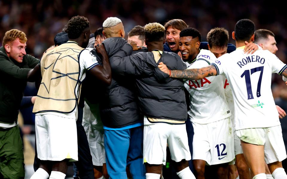 Tottenham Hotspur's Harry Kane celebrates with manager Antonio Conte and his team-mates after scoring a goal before it is later disallowed by VAR during the UEFA Champions League group D match at the Tottenham Hotspur Stadium, London. - PA 