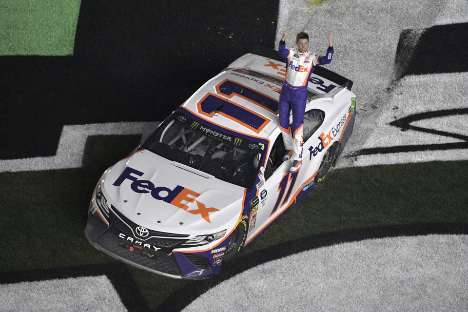 Denny Hamlin (11) celebrates after winning the NASCAR Daytona 500 auto race at Daytona International Speedway Sunday, Feb. 17, 2019, in Daytona Beach, Fla. (AP)