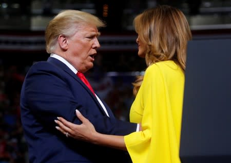 U.S. President Donald Trump reacts with first lady Melania Trump as he formally kick off his re-election bid with a campaign rally in Orlando