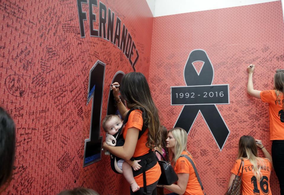<p>Fans sign a wall at a makeshift memorial for Miami Marlins pitcher Jose Fernandez before a baseball game between the Miami Marlins and the New York Mets, Monday, Sept. 26, 2016, in Miami. Fernandez died in a boating accident early Sunday. (AP Photo/Lynne Sladky) </p>