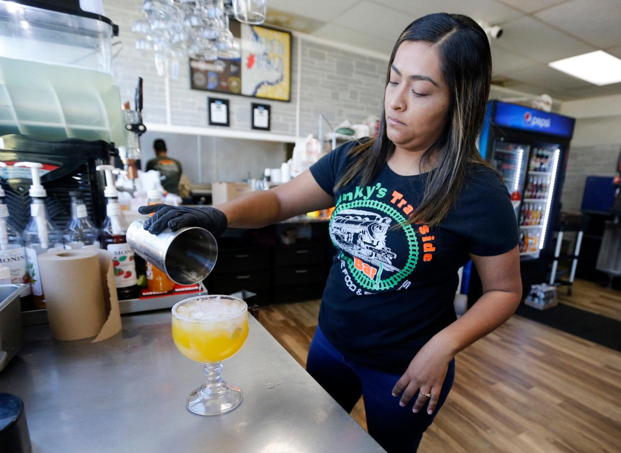 Guadalupe Pena, manager at Franky’s Tacos on East Mishawaka Avenue, makes a margarita Monday, April 22, 2024, in an area where businesses are taking advantage of the new downtown liquor license program.