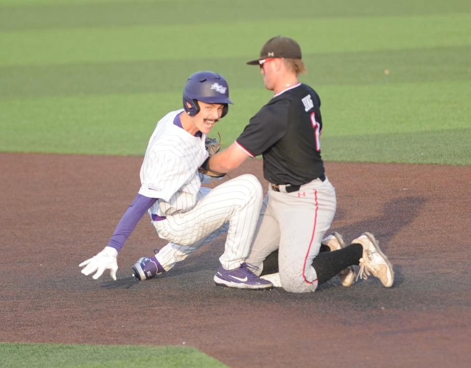 ACU's Mitchell Dickson slides safely into second base with a double as Texas Tech's Jace Jung tries to tag him out.