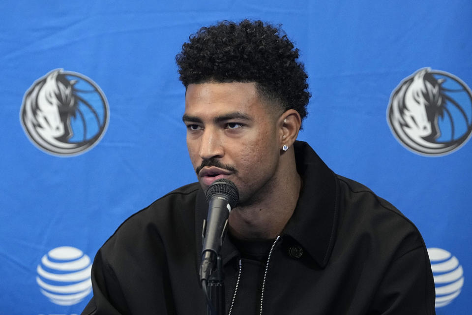 Quentin Grimes responds to questions during an NBA basketball news conference at the Dallas Mavericks practice facility in Dallas, Tuesday, July 9, 2024. (AP Photo/Tony Gutierrez)