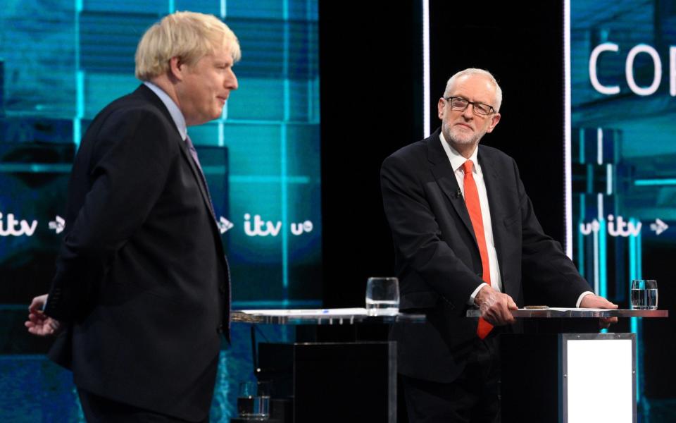 Boris Johnson and Jeremy Corbyn went head-to-head in the first televised debate of the election campaign on Tuesday evening. - AFP