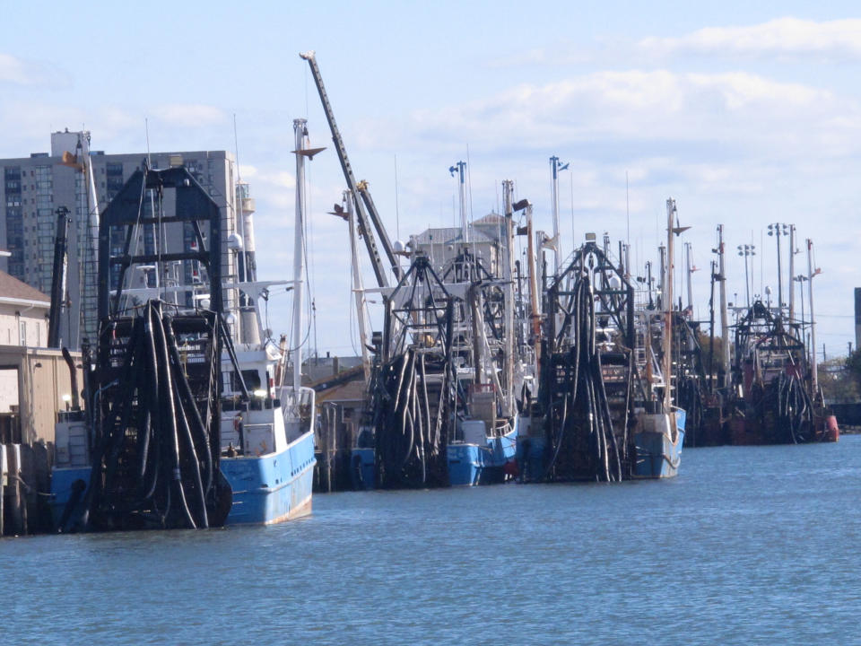 This Oct. 18, 2019 photo shows commercial fishing boats docked in Atlantic City, N.J. On Oct. 22, 2019, a conference at Monmouth University in West Long Branch, N.J. examined growing competition for space out on the ocean by users including the fishing, shipping, wind energy industries and conservationists. (AP Photo/Wayne Parry)
