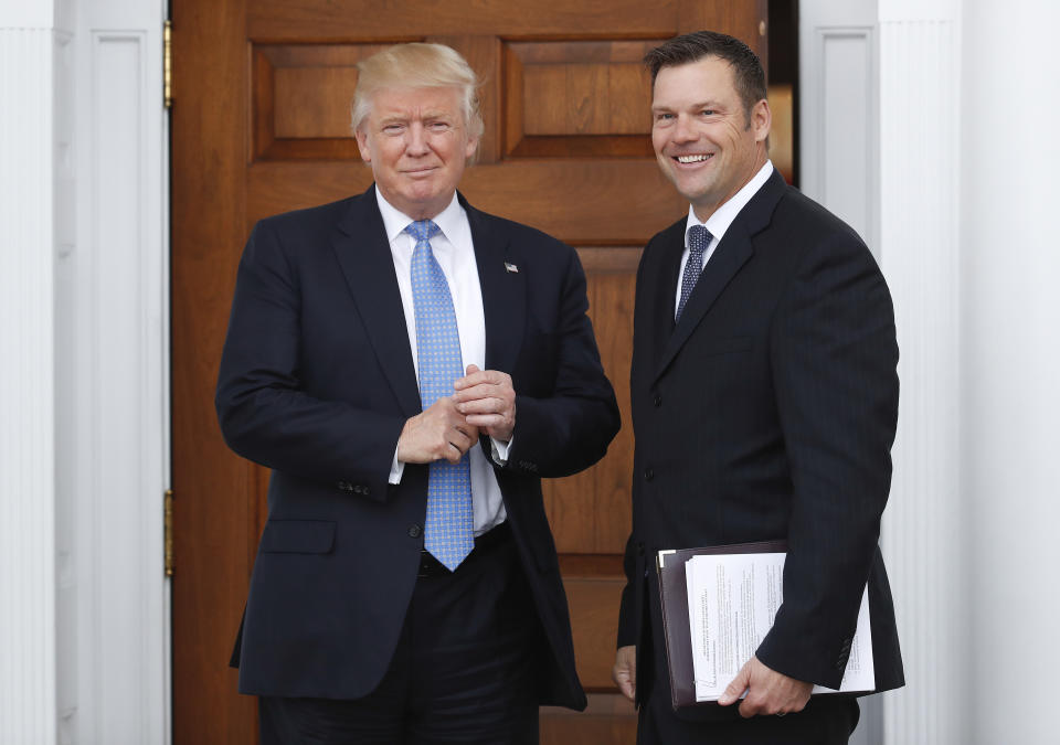 Kansas Secretary of State Kris Kobach meets with President-elect Donald Trump at the Trump National Golf Club Bedminster clubhouse in Bedminster, N.J., in November 2016. (Photo: Carolyn Kaster, AP)