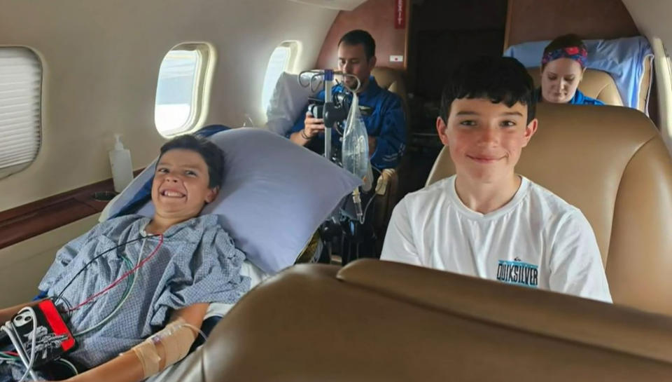 Dillon Armijo, 10, being airlifted with his family back to the United States. Source: Australscope