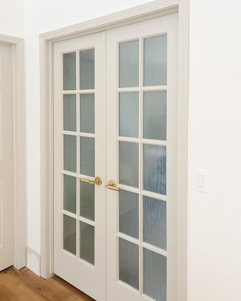 French doors with glass panels covered in reeded glass window film.