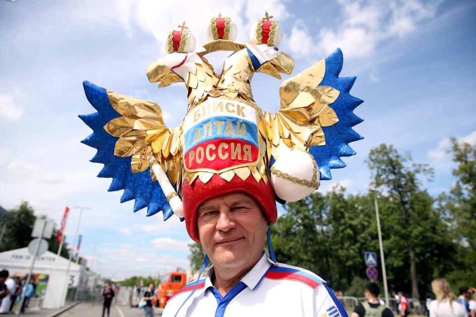 <p>Russian to be involved: A fan of the host nation sports some elaborate headgear in Moscow before the first Group A fixture. (Getty) </p>