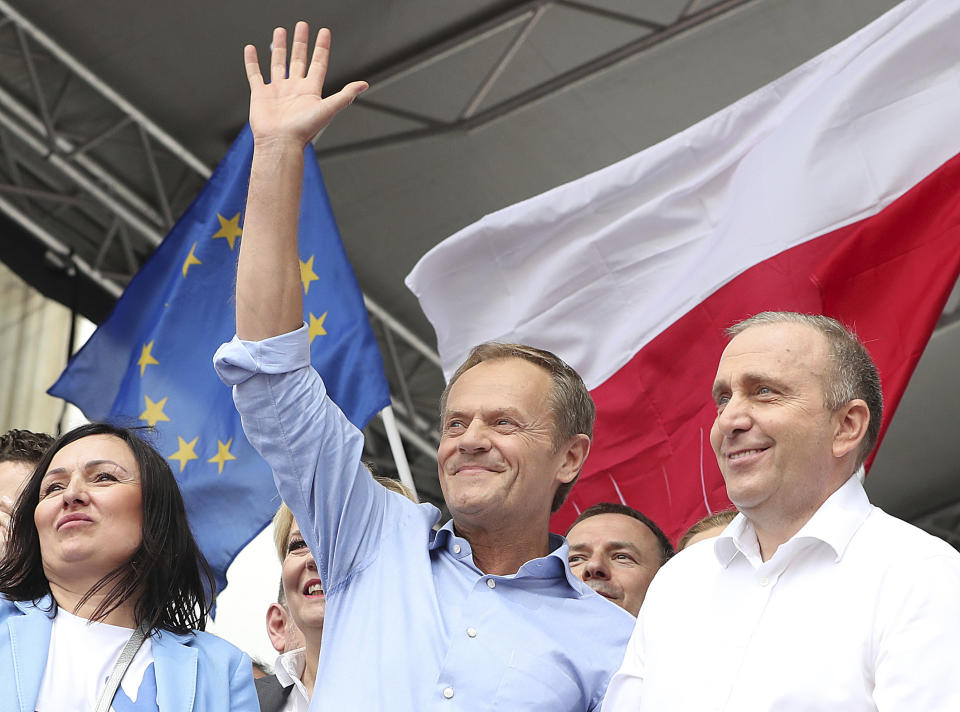 European Union Council President Donald Tusk,center, leads a march celebrating Poland's 15 years in the EU and stressing the nation's attachment to the 28-member bloc ahead of May 26 key elections to the European Parliament, in Warsaw, Poland, Saturday, May 18, 2019. (AP Photo/Czarek Sokolowski)