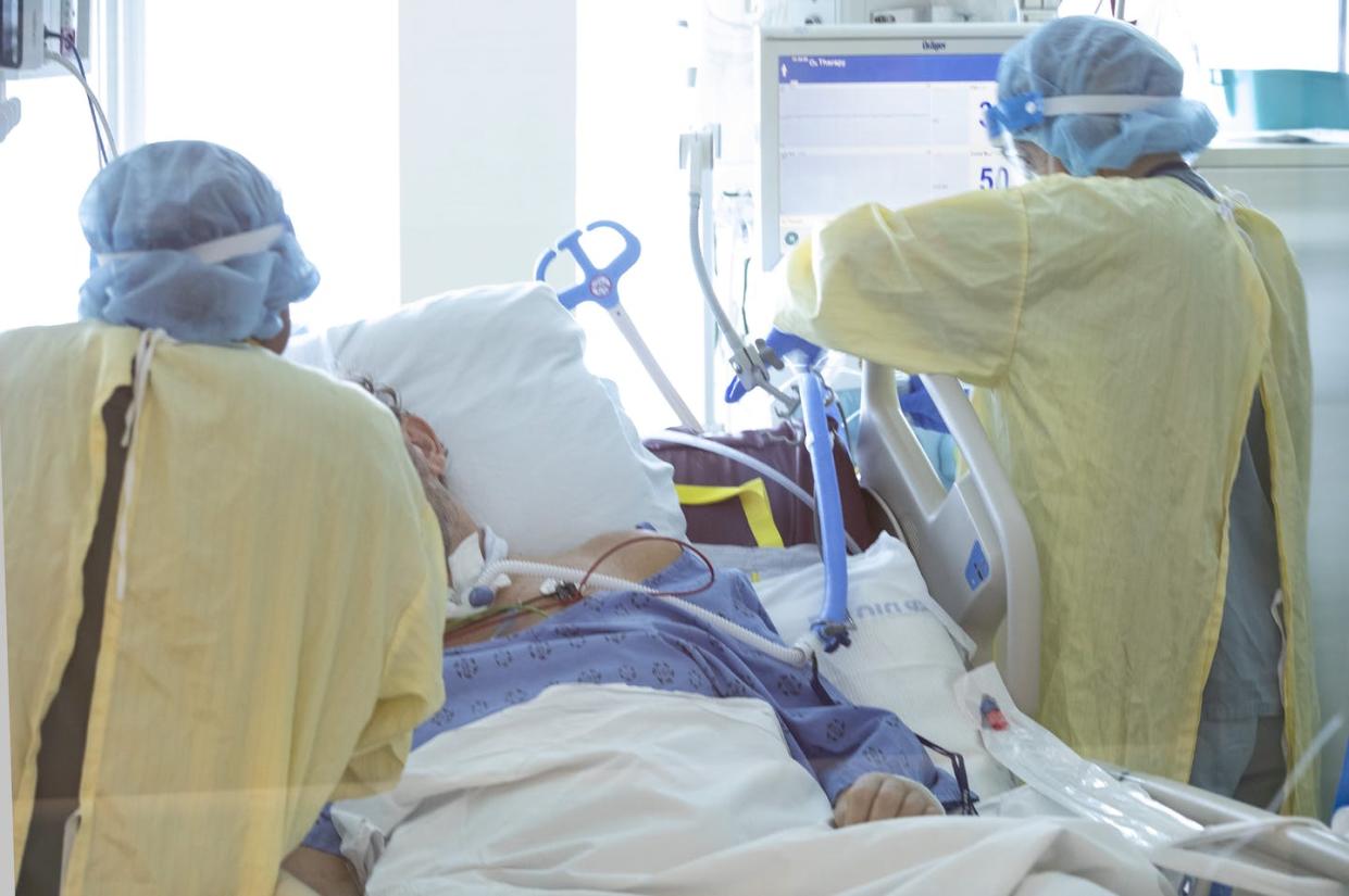 <span class="caption">Nurses tend to a COVID-19 patient in the intensive care unit at the Bluewater Health Hospital in Sarnia, Ont., in January 2022. The pandemic exposed the flaws in Canada's struggling health-care system, and offers a chance for Canada to reform it if the country's premiers step up. </span> <span class="attribution"><span class="source">THE CANADIAN PRESS/Chris Young</span></span>