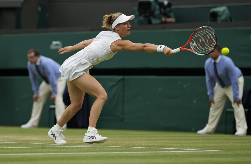 Switzerland's Viktorija Golubic plays a return to Czech Republic's Karolina Pliskova on day eight of the Wimbledon Tennis Championships in London, Tuesday, July 6, 2021. (AP Photo/Alastair Grant)
