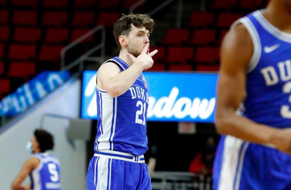 Duke’s Matthew Hurt (21) celebrates after hitting a three-pointer during the first half of N.C. State’s game against Duke at PNC Arena in Raleigh, N.C., Saturday, February 13, 2021.