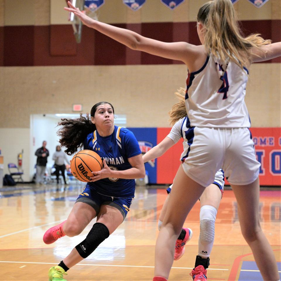 Cardinal Newman's Julia Vazquez drives down the court against King's Academy in the Crusaders' district title game on Feb. 3 2023.