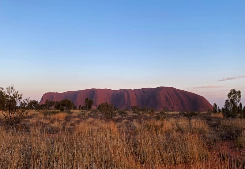 A view of Uluru, formerly known as Ayers Rock, the day before a permanent ban on climbing the monolith takes effect following a decades-long fight by indigenous people to close the trek, near Yulara