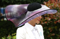 A racegoer wearing a galatic inspired hat. <em>[Photo: PA]</em>