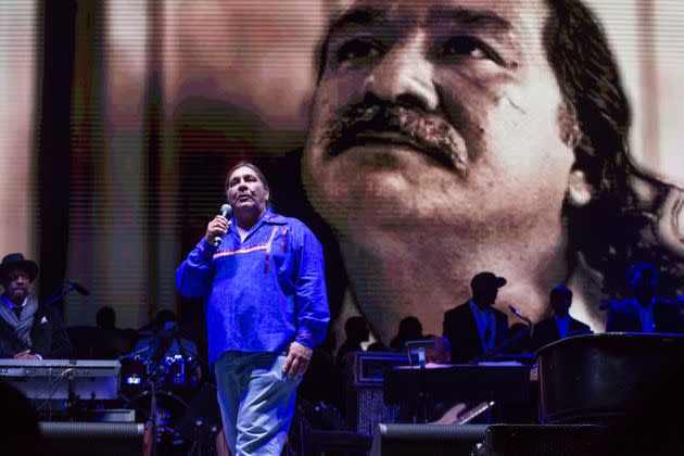 Chauncey Peltier, son of Leonard Peltier (pictured on the video behind him), speaks at Harry Belafonte's Many Rivers Music, Art & Social Justice festival in Chattahoochee Hills, Georgia, in October 2016. (Photo: NurPhoto via Getty Images)