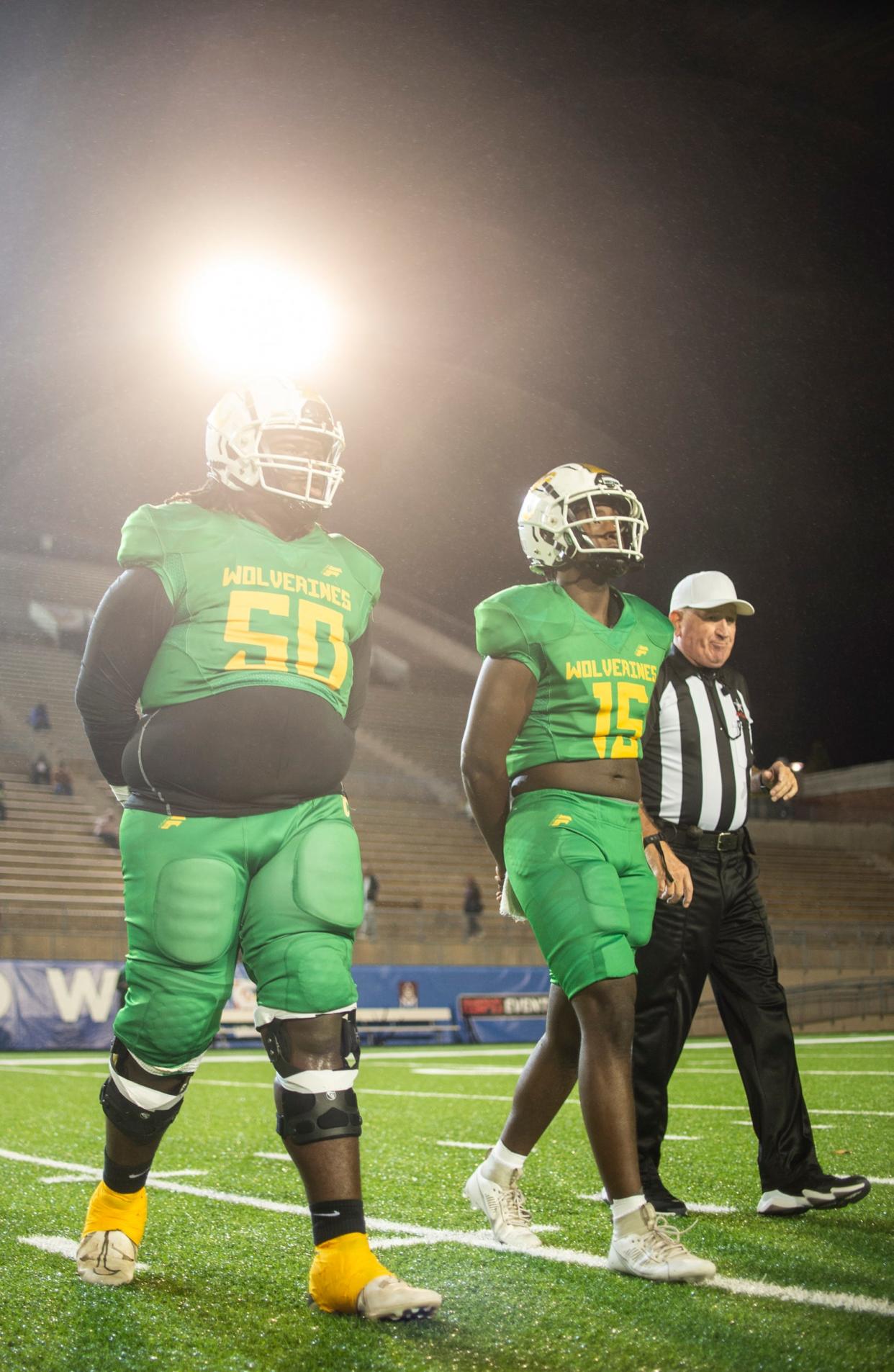 Carver team captains head to the coin toss at Cramton Bowl in Montgomery, Ala., on Thursday, Oct. 12, 2023. Carver leads Wetumpka 21-7 at halftime.