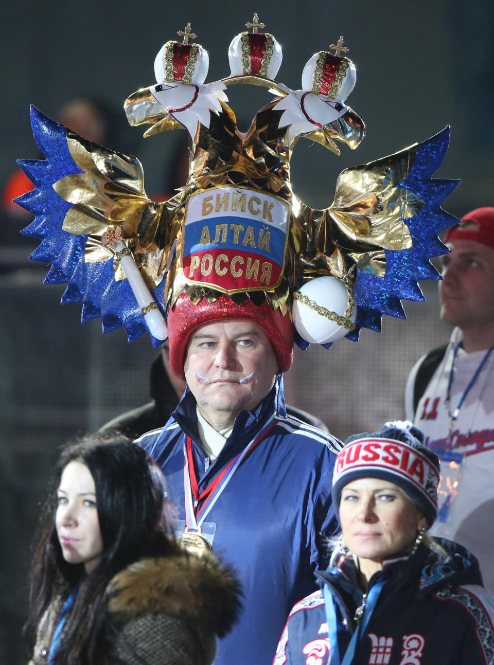 Russian supporters wait for the Medal Ceremony at the Sochi medals plaza during the Sochi Winter Olympics on Feb. 19, 2014. 