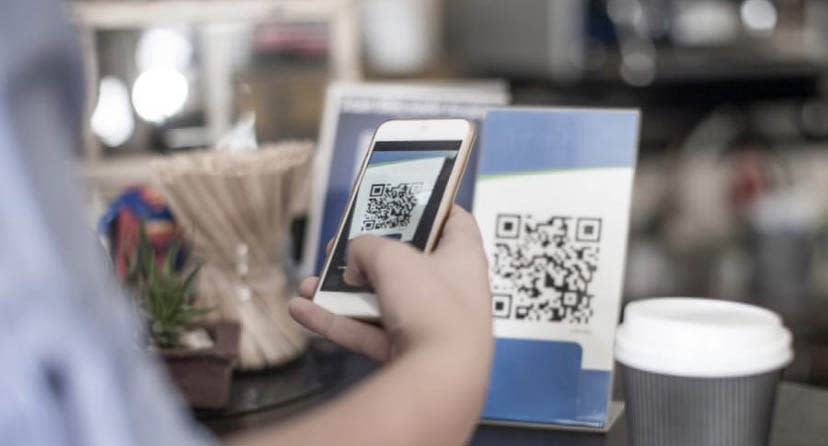 Close up of somebody checking into a venue using a QR code. Source: Facebook/NSW Health 