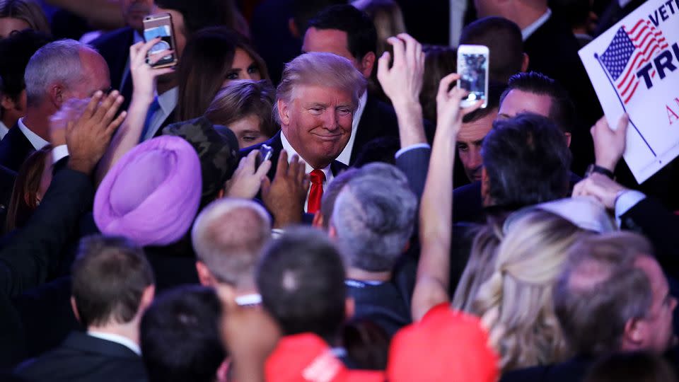 Republican president-elect Donald Trump greets people in the crowd after delivering his acceptance speech. Photo: Getty Images