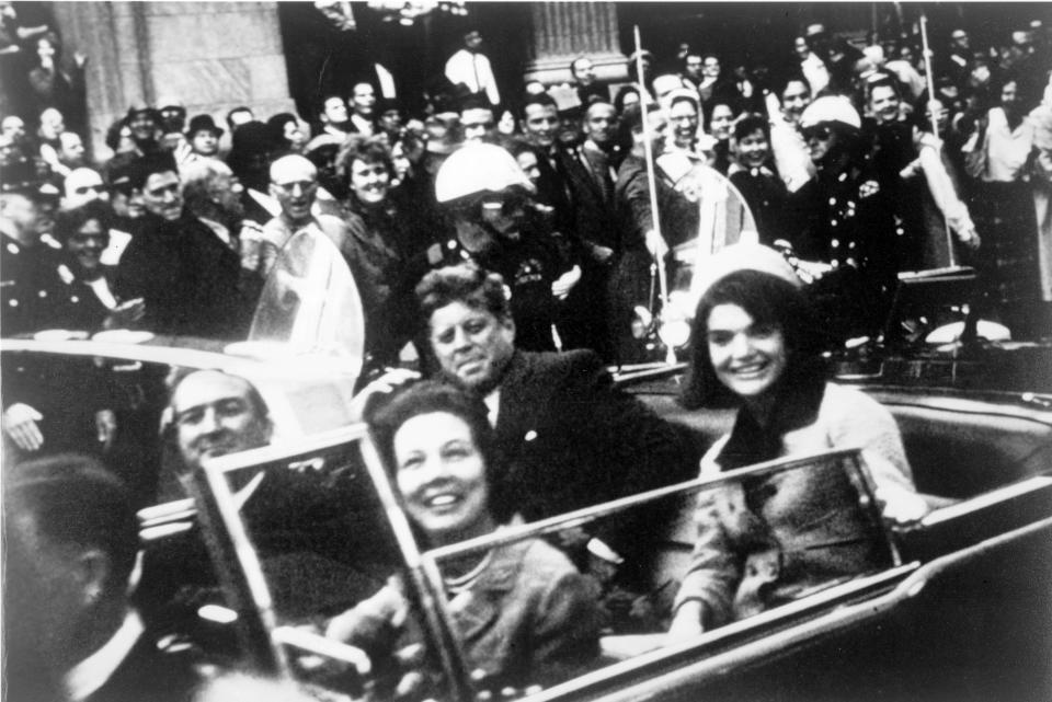 John F Kennedy and his wife Jackie in the presidential motorcade (Getty Images)