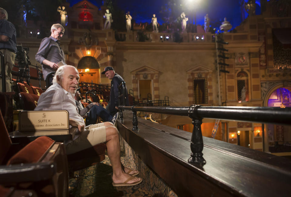 Jimmy Buffett, left, tries out a seat at the Saenger Theater in New Orleans on Monday, June 12, 2017. Buffett, who popularized beach bum soft rock with the escapist Caribbean-flavored song “Margaritaville” and turned that celebration of loafing into an empire of restaurants, resorts and frozen concoctions, has died, Friday, Sept. 1, 2023. (Chris Granger /The Times-Picayune/The New Orleans Advocate via AP)