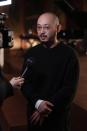 Designer Satoshi Kondo is interviewed after the Issey Miyake Fall/Winter 2024-2025 ready-to-wear collection presented Friday, March 1, 2024 in Paris. (Photo by Scott A Garfitt/Invision/AP)