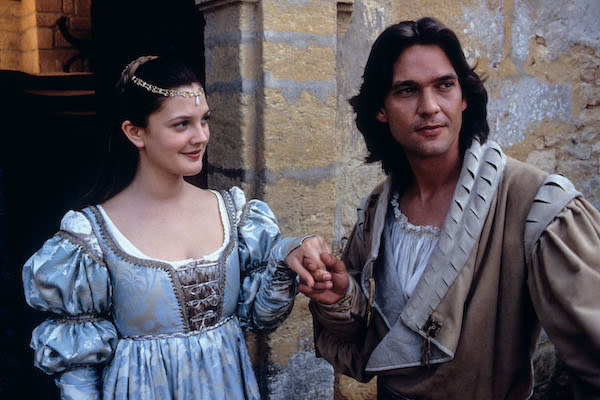 Drew Barrymore looking charmed as Dougray Scott holds her hand.