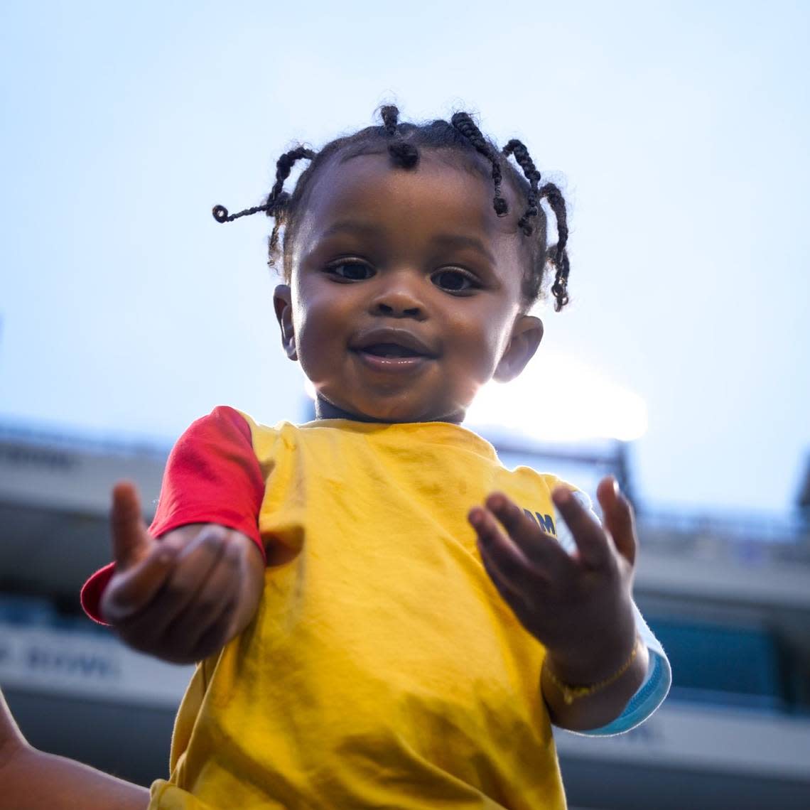 Kenzo Clark, the son of TCU safety Bud Clark, takes in a TCU football practice at Amon G. Carter on Friday.