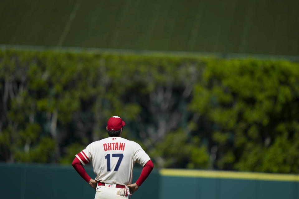 Los Angeles Angels designated hitter Shohei Ohtani warms up before a baseball game against the Houston Astros in Anaheim, Calif., Sunday, July 16, 2023. (AP Photo/Eric Thayer)