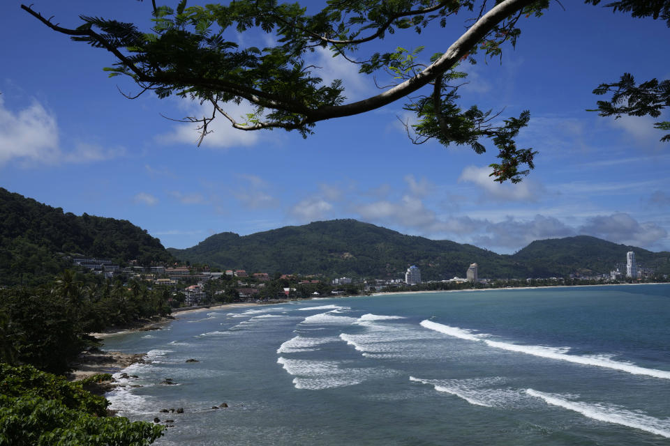Waves break on the empty tourist beach of Patong on Phuket, southern Thailand, Tuesday, June 29, 2021. Thailand's government will begin the "Phuket Sandbox" scheme to bring the tourists back to Phuket starting July 1. Even though coronavirus numbers are again rising around the rest of Thailand and prompting new lockdown measures, officials say there's too much at stake not to forge ahead with the plan to reopen the island to fully-vaccinated travelers. (AP Photo/Sakchai Lalit)