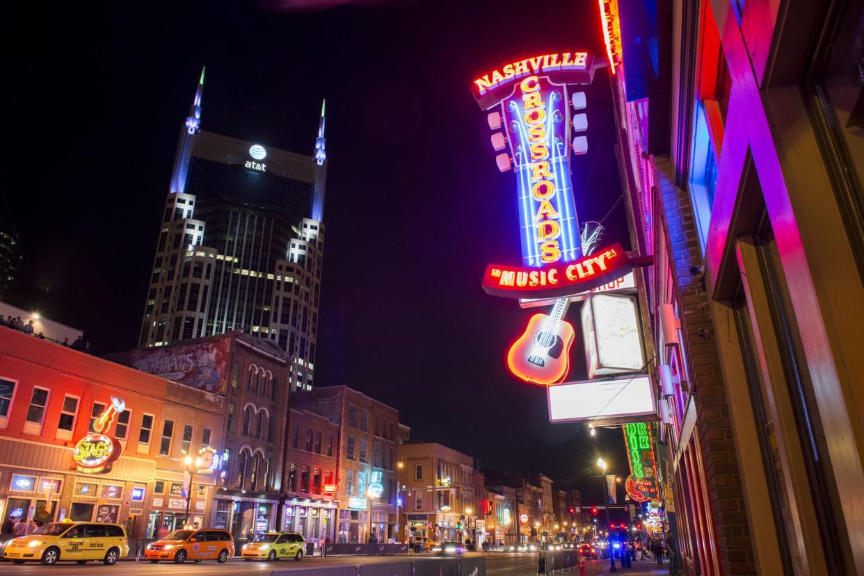 Nashville, United States - May 5, 2016: Tennessee Music Row street scene is illuminated with neon lights marking the area and various businesses.