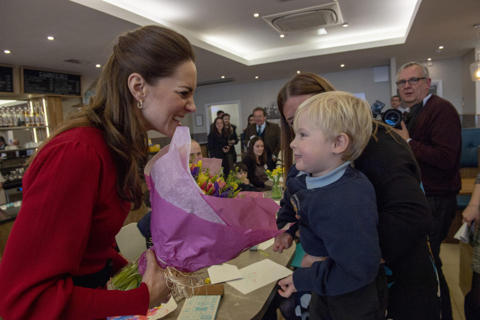 Grinning at a young boy after he presented her with flowers at Joe's Ice Cream Parlour on Mumbles Road, near Swansea in February 2020. Kate screwed up her nose showing her playful side. (Arthur Edwards/The Sun/PA Wire)