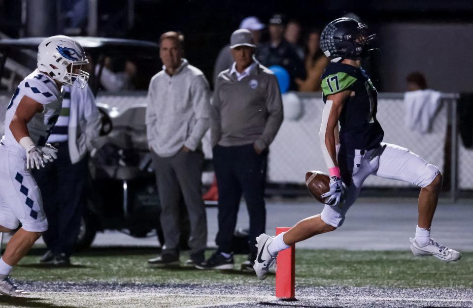 Timpanogos’ Gabe Graf runs the ball in for a touchdown in a high school football game against Salem Hills in Orem on Friday, Oct. 6, 2023. | Spenser Heaps, Deseret News