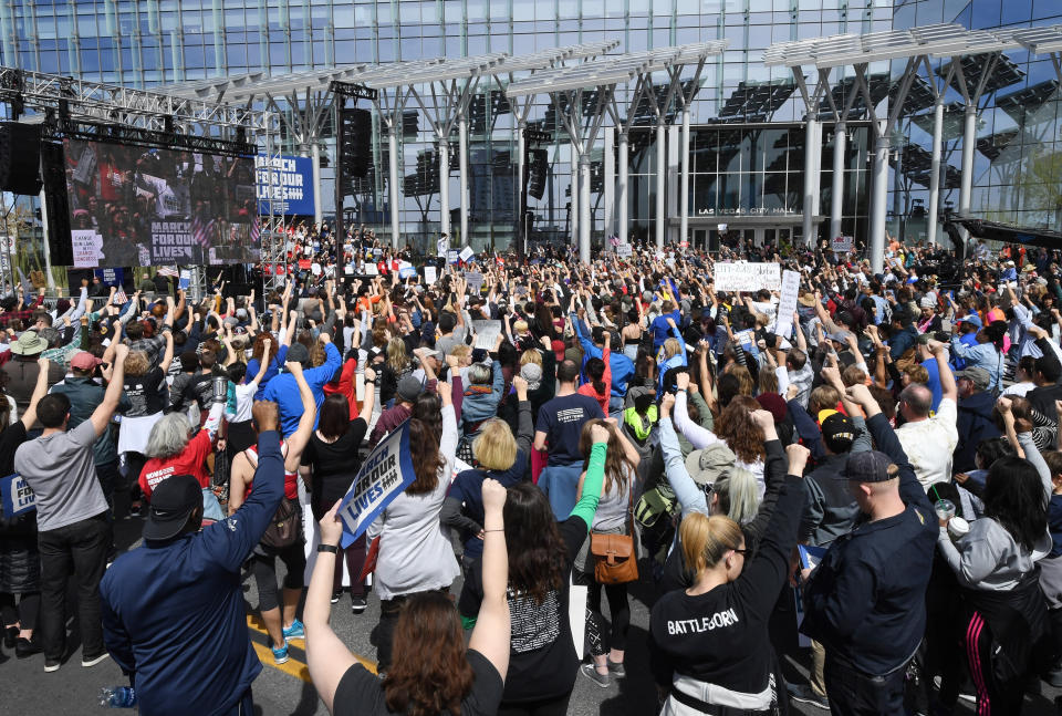 <p>Protestors raise their fists during the March for Our Lives rally at Las Vegas City Hall on March 24, 2018 in Las Vegas, Nevada. (Ethan Miller/Getty Images) </p>