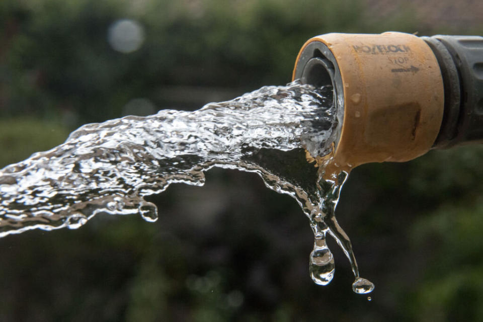 Picture of hose spilling water ahead of a Sydney's water restrictions. Source: Getty/file