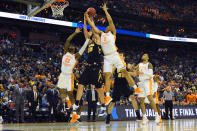 <p>Luka Garza #55 of the Iowa Hawkeyes fights for a rebound against Jordan Bowden #23 and Grant Williams #2 of the Tennessee Volunteers in the second round of the 2019 NCAA Men’s Basketball Tournament held at Nationwide Arena on March 24, 2019 in Columbus, Ohio. (Photo by Jamie Schwaberow/NCAA Photos via Getty Images) </p>