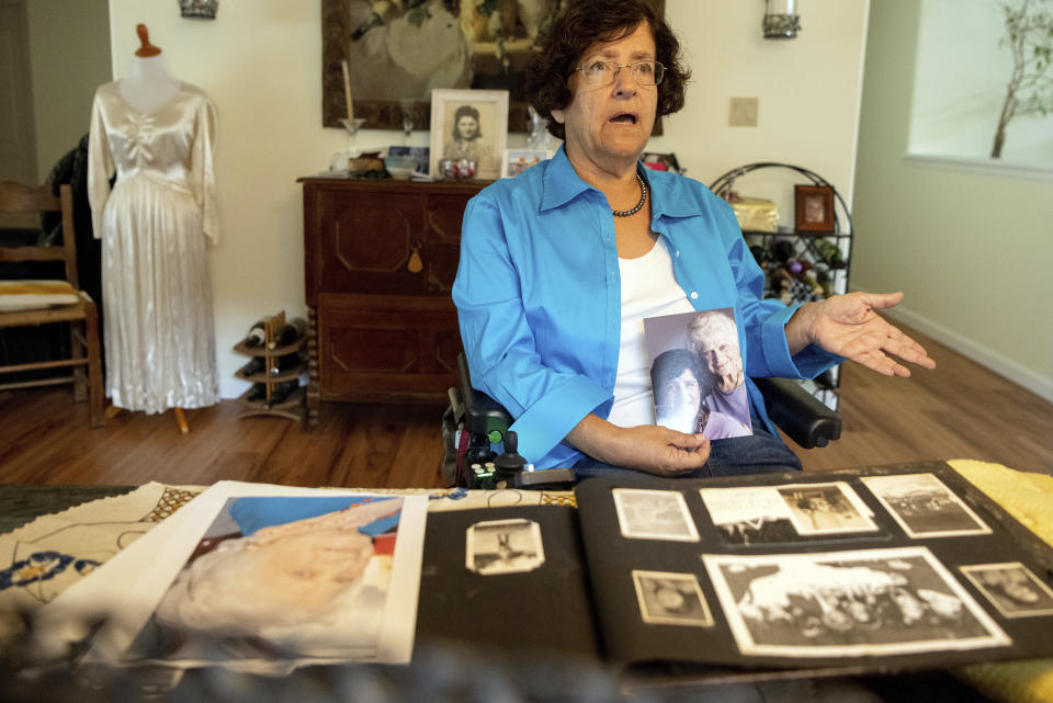 Dorene Giacopini talks about her mother Primetta Giacopini, who died of COVID-19, from her home in Richmond, Calif. on Monday, Sept 27, 2021. Primetta Giacopini's life ended the way it began — in a pandemic. She was two years old when she lost her mother to the Spanish flu in Connecticut in 1918. Giacopini contracted COVID-19 earlier this month. The 105-year-old struggled with the disease for a week before she died Sept. 16. (AP Photo/Josh Edelson)