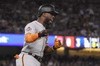 San Francisco Giants' Andrew McCutchen celebrates after hitting a three-run home run during the eighth inning of the team's baseball game against the Los Angeles Dodgers on Wednesday, Aug. 15, 2018, in Los Angeles. (AP Photo/Mark J. Terrill)