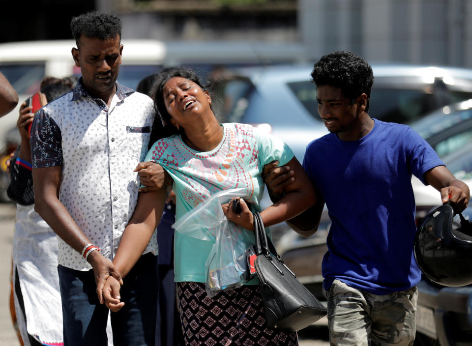 Relatives of victims react at a police mortuary, after bomb blasts ripped through churches and luxury hotels on Easter, in Colombo, Sri Lanka April 22, 2019. Photo: Dinuka Liyanawatte/Reuters)