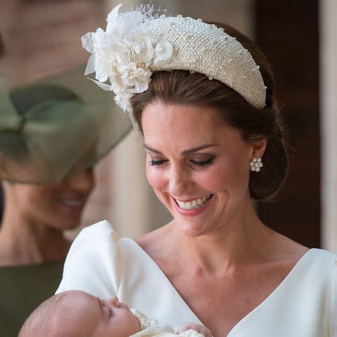 The Duchess of Cambridge carries Prince Louis as they arrive for his christening service at the Chapel Royal, St James's Palace, London - Credit:  Dominic Lipinski/PA